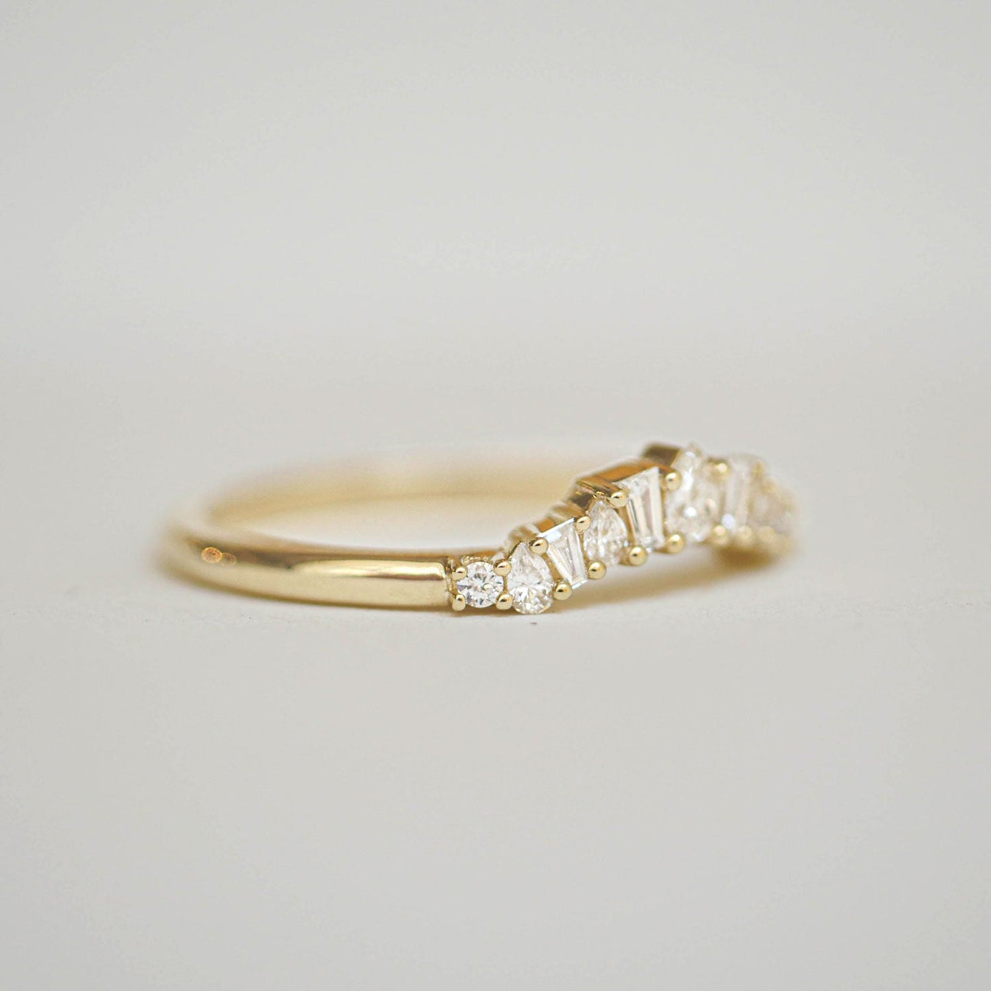 0.26 TCW Baguette Pear and Round cluster Wedding Band
