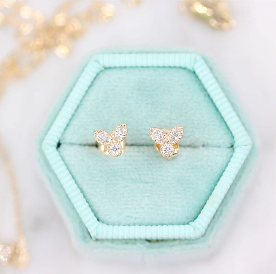 Natalie-  0.15 TCW Round & Marquise Moissanite Three Stone Style Stud Earrings