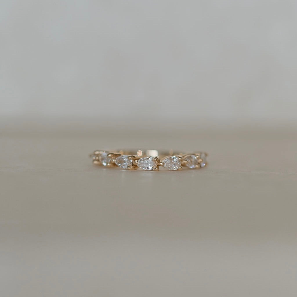 Alice-0.25 TCW Pear Moissanite Half Eternity Wedding Band