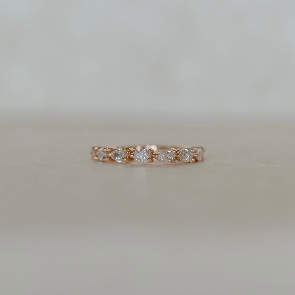 Alice-0.25 TCW Pear Moissanite Half Eternity Wedding Band